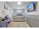 Charming bedroom with plush carpet, ample natural light, and a TV at 768 Trotters Ln, Moncks Corner, SC 29461
