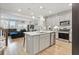 Open kitchen with stainless steel appliances, island, and view into the living area at 768 Trotters Ln, Moncks Corner, SC 29461