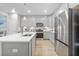 Modern kitchen with stainless steel appliances, grey cabinetry, and a center island at 768 Trotters Ln, Moncks Corner, SC 29461