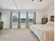 Bright main bedroom with large windows offering serene outdoor views and cozy carpet at 768 Trotters Ln, Moncks Corner, SC 29461