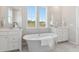 Bright bathroom with a soaking tub and double vanity sinks offering a luxurious and serene space at 776 Clay Field Trl, Summerville, SC 29485