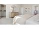 Bright bedroom features a round mirror, dresser, and closet with wire shelves for optimal storage solutions at 776 Clay Field Trl, Summerville, SC 29485
