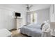 Bright bedroom features a ceiling fan, wood floors, and a large closet for ample storage at 7935 Parklane Ct # A, North Charleston, SC 29418
