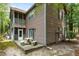 Exterior back of home features a screened in porch, a patio, and outdoor seating at 7935 Parklane Ct # A, North Charleston, SC 29418