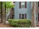 Exterior of the home is surrounded by greenery and features neutral toned shutters and siding at 7935 Parklane Ct # A, North Charleston, SC 29418