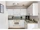 Functional kitchen with white appliances and cabinetry, offering a clean and bright space at 7935 Parklane Ct # A, North Charleston, SC 29418