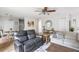 Cozy living room with contemporary furniture, wood-look flooring, and an open concept layout at 7935 Parklane Ct # A, North Charleston, SC 29418