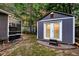 Backyard with a charming shed and greenhouse, perfect for storage or hobbies with mature trees around at 8 Pony Ln, Charleston, SC 29407