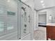Bright bathroom with modern tub, white subway tile surround, and glass door at 8 Pony Ln, Charleston, SC 29407