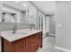 Bathroom featuring a double sink with cherry wood cabinets, tile floor, and modern fixtures at 8 Pony Ln, Charleston, SC 29407