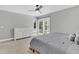 Bedroom featuring a dresser, ceiling fan, and sliding glass doors that bring in natural light at 8 Pony Ln, Charleston, SC 29407