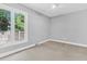 This bedroom features a large window and a ceiling fan at 8 Pony Ln, Charleston, SC 29407