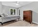 This bedroom features large windows and a hardwood dresser at 8 Pony Ln, Charleston, SC 29407