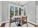 Cozy dining area with modern table, chairs, and a view of the backyard at 8 Pony Ln, Charleston, SC 29407