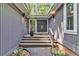 Welcoming front entrance with a stylish double door, sidelight window and modern outdoor lighting at 8 Pony Ln, Charleston, SC 29407