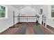Bright home gym featuring hardwood floors, natural light, ballet barre, and workout equipment at 8 Pony Ln, Charleston, SC 29407