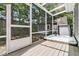 Hot tub in screened in porch, with an easy-access door, perfect for year-round enjoyment and relaxation at 8 Pony Ln, Charleston, SC 29407