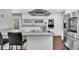 Bright kitchen with stainless steel appliances, large island, and modern fixtures at 8 Pony Ln, Charleston, SC 29407