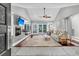 Bright living room with fireplace, hardwood floors, and sliding glass doors to the backyard at 8 Pony Ln, Charleston, SC 29407