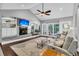 Cozy living room featuring a fireplace, TV, and open access to the dining and kitchen areas at 8 Pony Ln, Charleston, SC 29407
