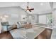 Open-concept living room with vaulted ceiling, fireplace, and modern decor at 8 Pony Ln, Charleston, SC 29407