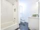 Bathroom featuring subway tile shower, tub, and granite countertop vanity at 84 Bull St # F, Charleston, SC 29401