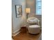 Cozy bedroom with a comfortable chair, natural light, and tranquil ambiance at 84 Bull St # F, Charleston, SC 29401