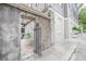 Courtyard view with a peek through the concrete wall at 84 Bull St # F, Charleston, SC 29401