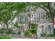 Charming home with a lovely front porch, a fenced yard, and mature trees offering shade and curb appeal at 84 Bull St # F, Charleston, SC 29401