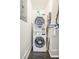 Efficient laundry room with stacked washer and dryer at 84 Bull St # F, Charleston, SC 29401