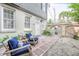 Cozy patio area featuring comfortable seating, lush greenery, and a charming space for outdoor enjoyment at 84 Bull St # F, Charleston, SC 29401