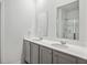 Bright bathroom with a double sink vanity, large mirror, and a separate glass-enclosed shower at 849 Kirby Ct, Charleston, SC 29414