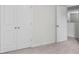 Bedroom with double door closet and a second white door, all accented with white trim at 849 Kirby Ct, Charleston, SC 29414