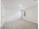 An empty carpeted room offering a blank canvas with lots of natural light through the window at 849 Kirby Ct, Charleston, SC 29414