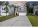Charming two-story home features a large driveway and attached garage at 849 Kirby Ct, Charleston, SC 29414