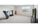 Bright fitness room includes carpet and has a window offering natural light at 849 Kirby Ct, Charleston, SC 29414