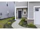 Charming front entrance with decorative bushes along a curved walkway, providing a warm welcome at 849 Kirby Ct, Charleston, SC 29414