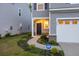 Well-maintained front entrance with landscaped walkway and attached garage at 849 Kirby Ct, Charleston, SC 29414