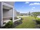 Well-manicured front yard with a winding walkway and lush landscaping, enhancing curb appeal at 849 Kirby Ct, Charleston, SC 29414