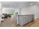 A spacious living room and kitchen area with hardwood floors and neutral walls with stainless steel appliances at 849 Kirby Ct, Charleston, SC 29414