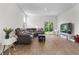 Spacious living room with wood-look flooring, a sectional sofa, and sliding glass doors at 849 Kirby Ct, Charleston, SC 29414