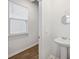 Bright powder room featuring pedestal sink, window, and modern fixtures at 849 Kirby Ct, Charleston, SC 29414