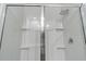 Modern shower features glass doors, rainfall shower head, and built-in shelving at 849 Kirby Ct, Charleston, SC 29414