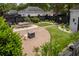 Entertainer's backyard featuring brick pavers, synthetic turf, and outdoor dining area at 861 Center Park St, Charleston, SC 29492