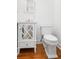 Stylish bathroom features a decorative mirror, white vanity, and contemporary toilet at 861 Center Park St, Charleston, SC 29492