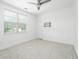 Bright bedroom featuring neutral carpeting and large windows for ample natural light at 861 Center Park St, Charleston, SC 29492