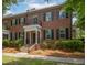 Beautiful brick townhome featuring a covered entryway and second story balcony at 861 Center Park St, Charleston, SC 29492