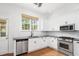 Bright kitchen features modern stainless steel appliances and white cabinets at 861 Center Park St, Charleston, SC 29492