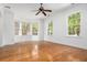 Bright living room features hardwood floors, a ceiling fan, and a bay window at 861 Center Park St, Charleston, SC 29492