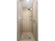 Shower featuring stylish tiling and shower head with metal hardware and glass door at 861 Center Park St, Charleston, SC 29492